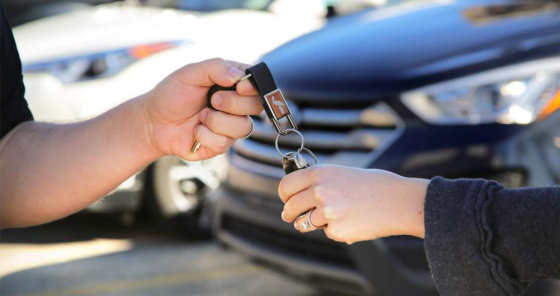 man giving keys to the woman