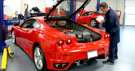 technician checking car's engine