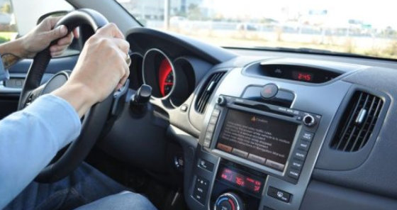 man driving a car